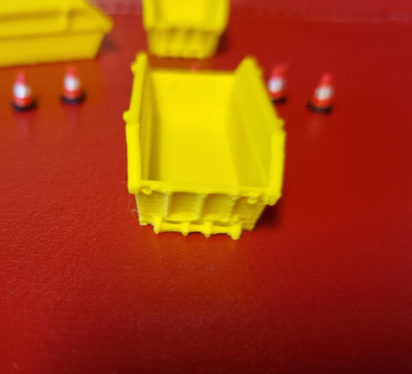 00 gauge 3 x 8 yd skip with 6 road cones 3D printed in Yellow