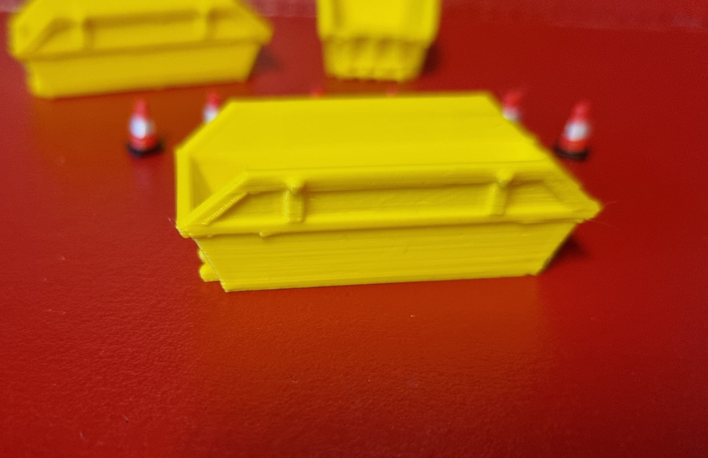 00 gauge 3 x 8 yd skip with 6 road cones 3D printed in Yellow