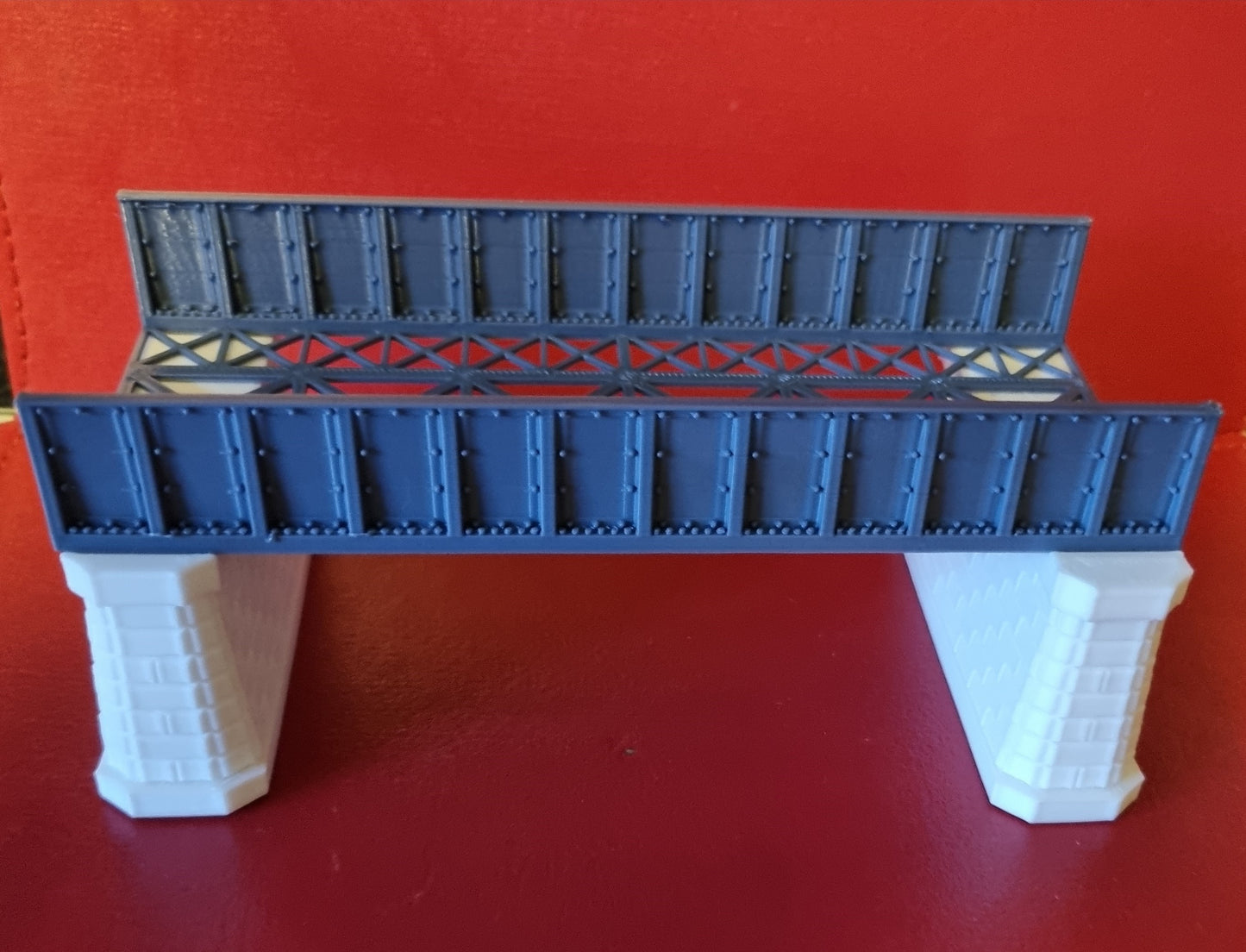 00 Gauge Girder style bridge 3D Printed in grey with support pillars.