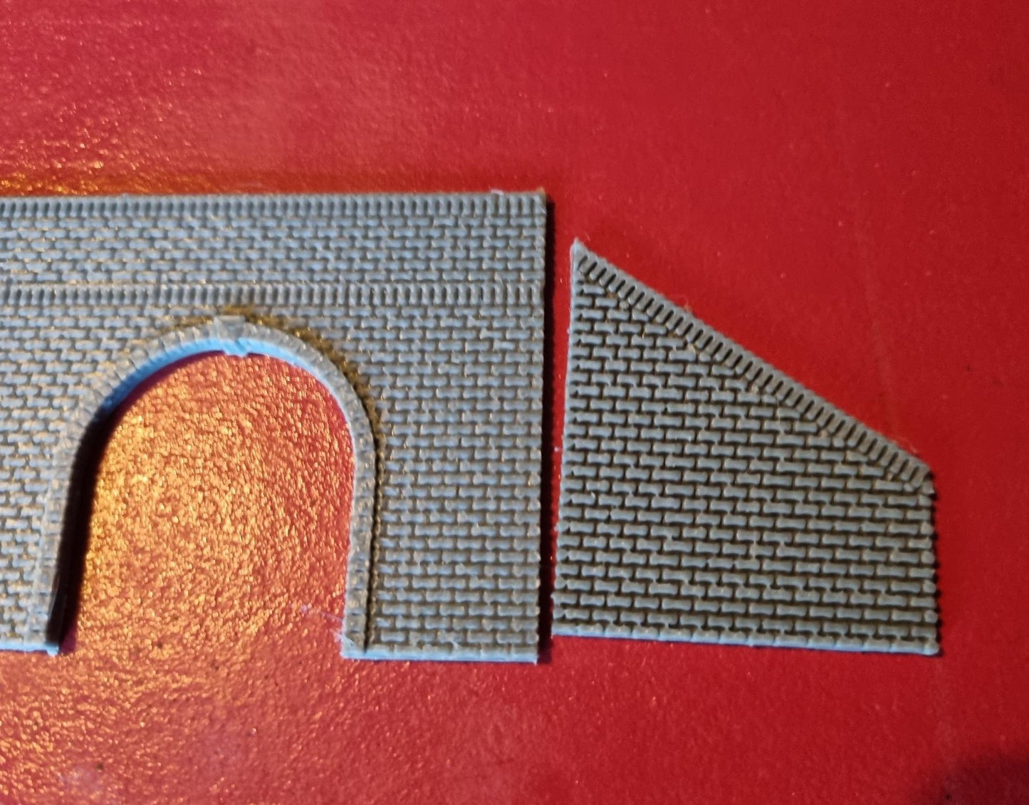 Z gauge Single track tunnel portal 3D printed with brick detail and retaining walls.